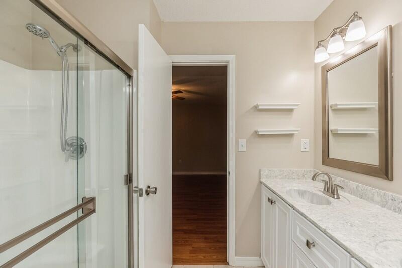 401 Ashley Drive Crestview, FL 32536 - Photo 20 of 36 a bathroom with a double vanity sink and mirror