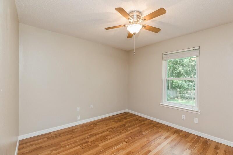 401 Ashley Drive Crestview, FL 32536 - Photo 23 of 36 an empty room with a window and a fan