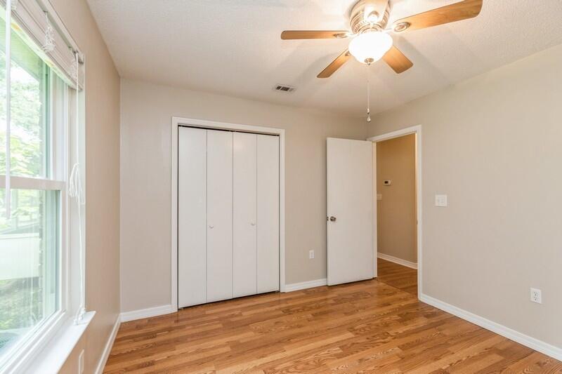 401 Ashley Drive Crestview, FL 32536 - Photo 24 of 36 a view of a room with a ceiling fan and a window