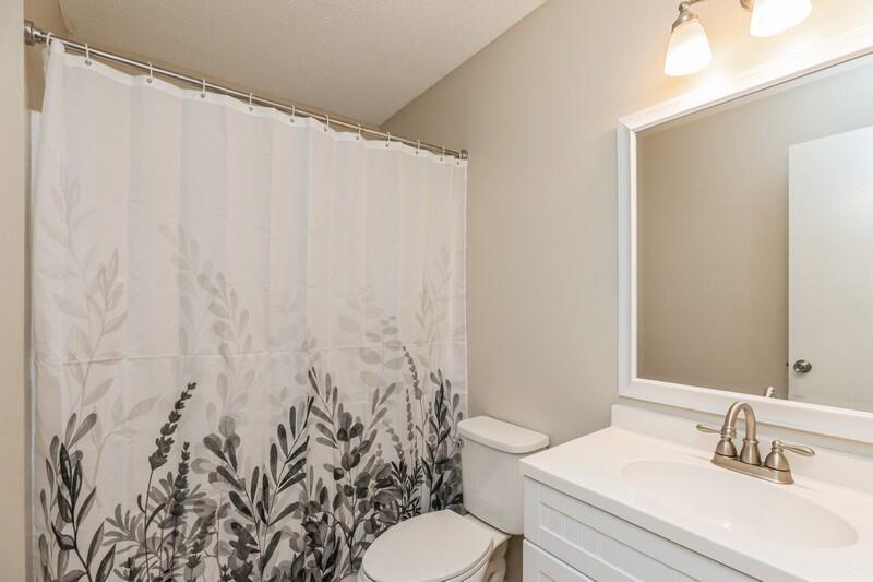 401 Ashley Drive Crestview, FL 32536 - Photo 27 of 36 a bathroom with a sink toilet and a mirror