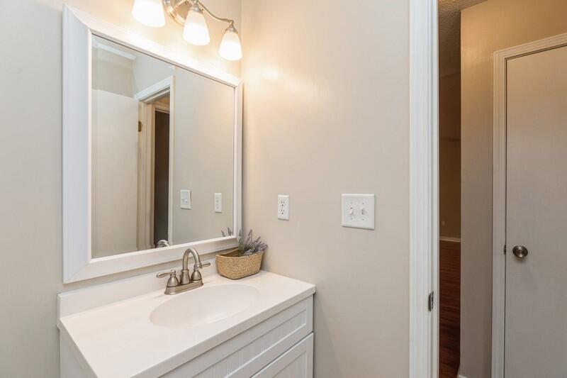 401 Ashley Drive Crestview, FL 32536 - Photo 28 of 36 a bathroom with a sink vanity and a mirror