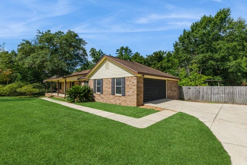 401 Ashley Drive Crestview, FL 32536 - Photo 4 of 36 a front view of house with yard and green space