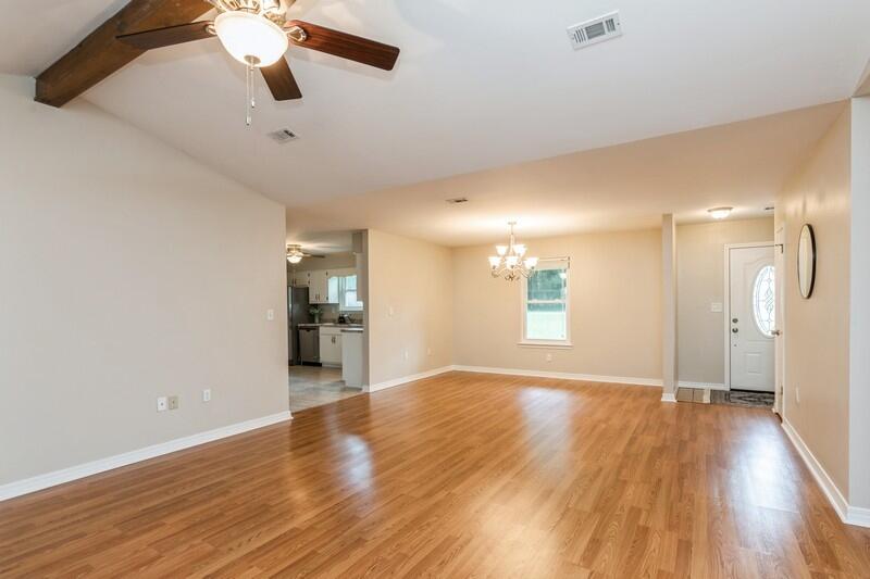 401 Ashley Drive Crestview, FL 32536 - Photo 9 of 36 a view of empty room with wooden floor