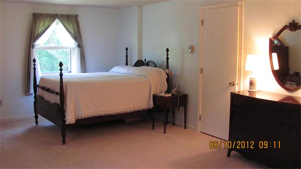 73 Strong Road Southampton, MA 01073 - Photo 12 of 19 a bed sitting in a bedroom next to a window