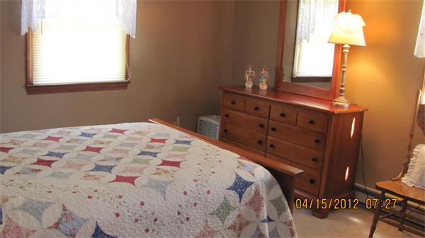 73 Strong Road Southampton, MA 01073 - Photo 10 of 19 a bedroom with a bed and a dresser