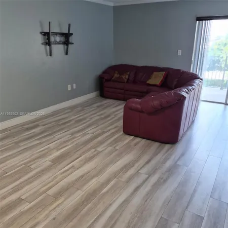 a living room with a couch and a window
