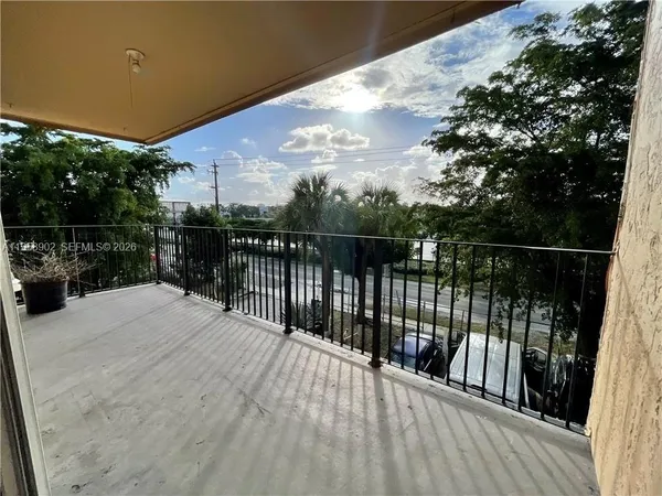 a balcony with wooden floor