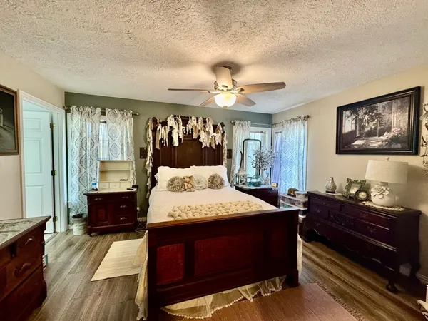 a bed room with a bed and a chandelier