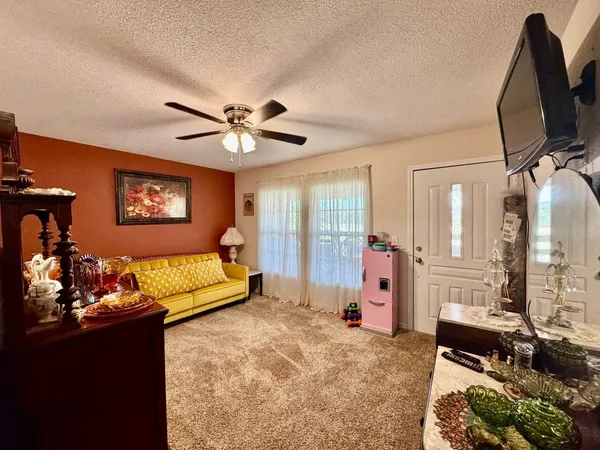 a bedroom with furniture and a chandelier