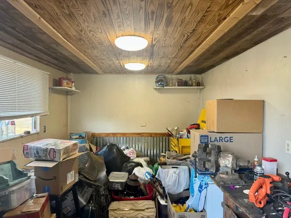 a bedroom with furniture and a chandelier