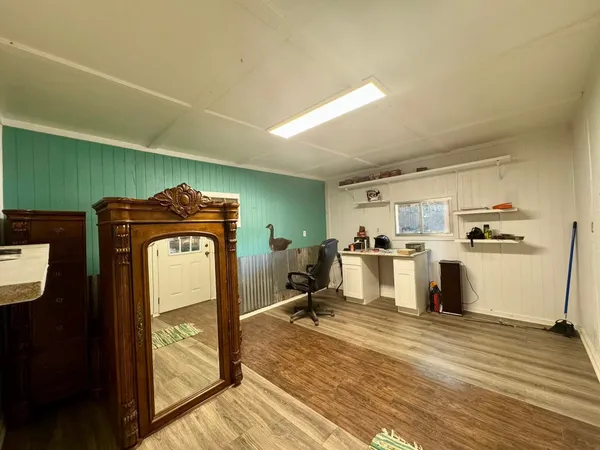 a view of a kitchen with wooden floor