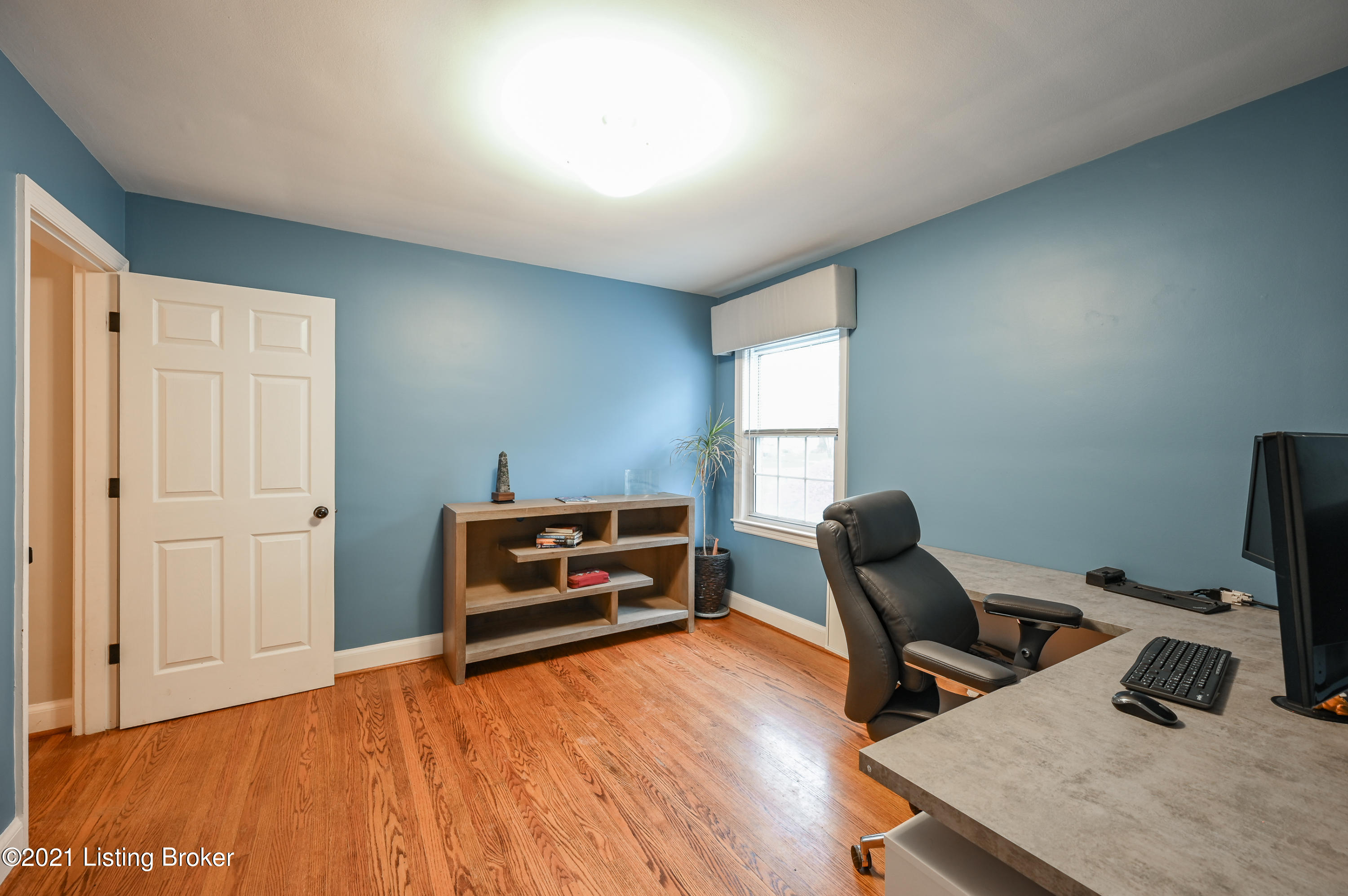213 Don Allen Road Louisville, KY 40207 - Photo 22 of 53 The bonus room offers hardwood floors, closet space, natural light from the window, and an overhead light fixture