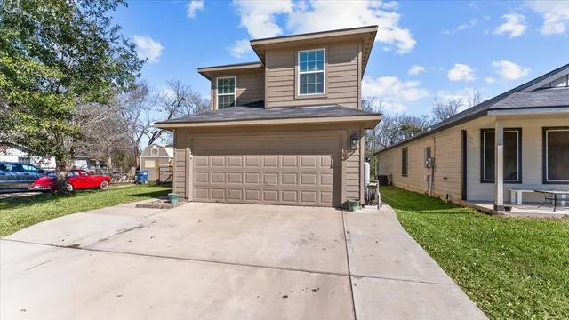 a front view of house with yard and trees