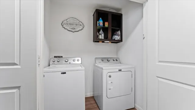 a view of storage and utility room with washer and dryer