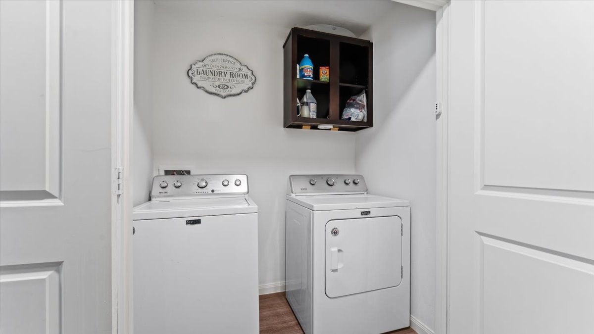 3975 Sam Houston Road Willis, TX 77378 - Photo 19 of 38 a view of storage and utility room with washer and dryer