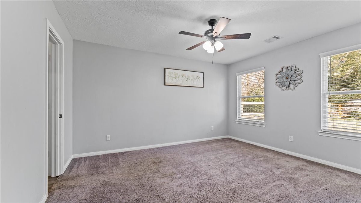 3975 Sam Houston Road Willis, TX 77378 - Photo 20 of 38 a view of an empty room with a window