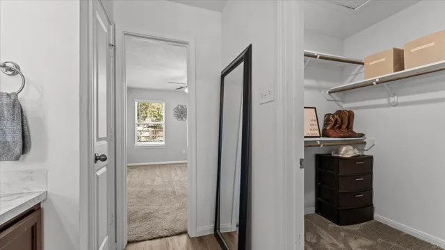 a view of a workspace with furniture and gym equipment