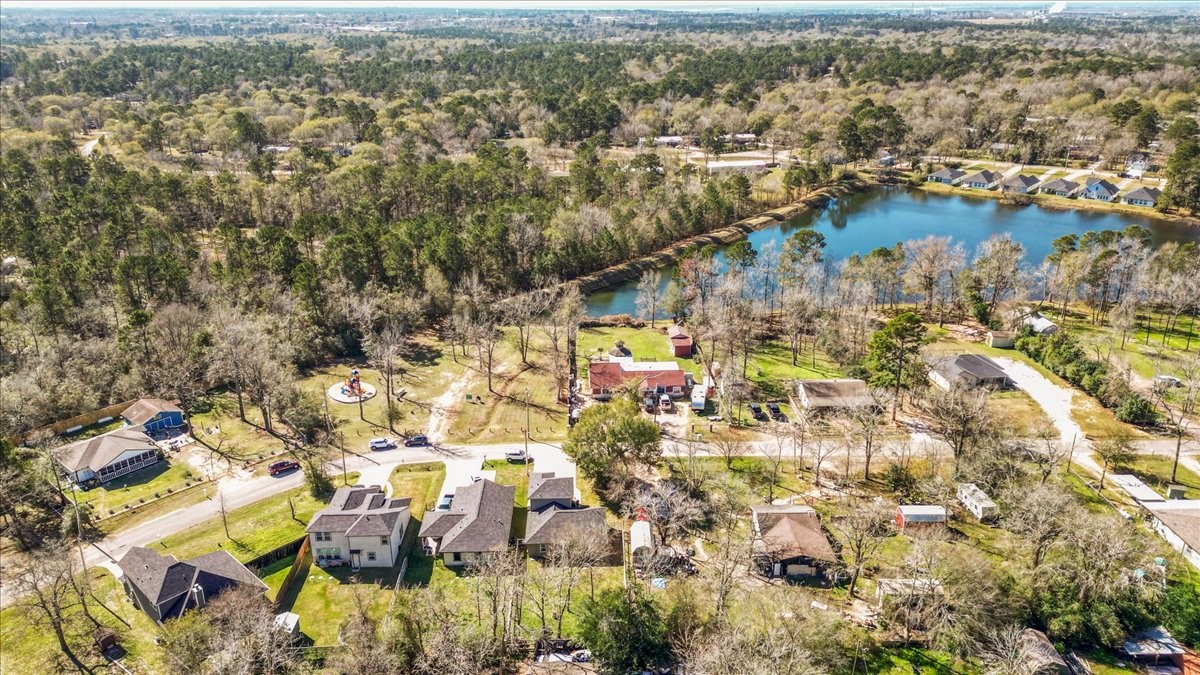 3975 Sam Houston Road Willis, TX 77378 - Photo 31 of 38 an aerial view of residential building with parking space