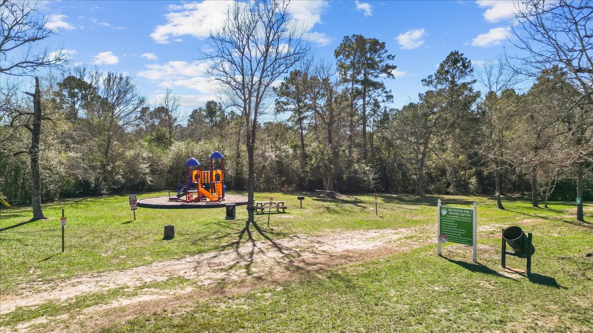 3975 Sam Houston Road Willis, TX 77378 - Photo 33 of 38 a view of a bench in a park