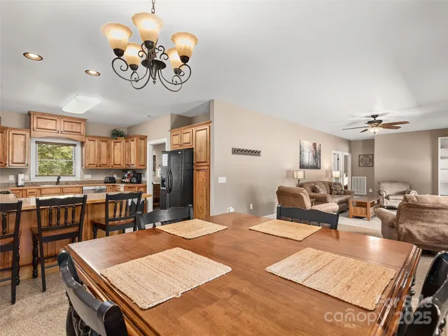 a large kitchen with a table and chairs