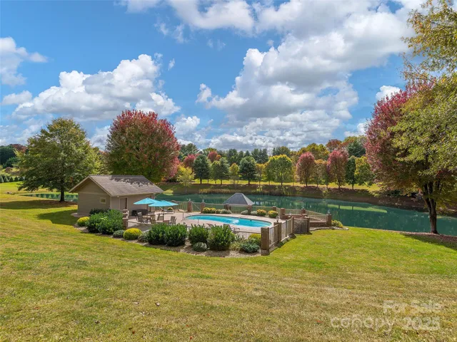 a view of a lake with a house in the background