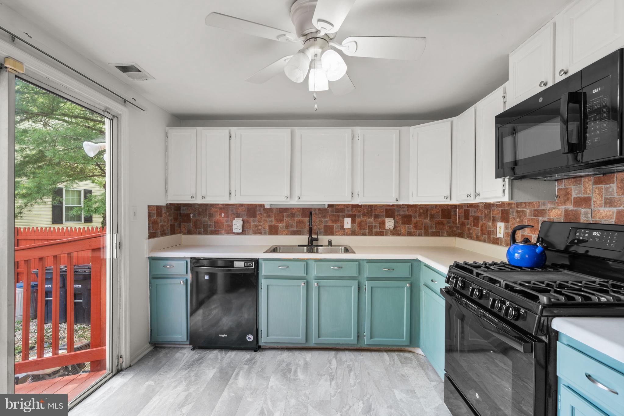 5136 Cranmer Way Capitol Heights, MD 20743 - Photo 14 of 28 a kitchen with stainless steel appliances granite countertop a stove and a sink