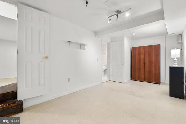 a view of an empty room with a fireplace