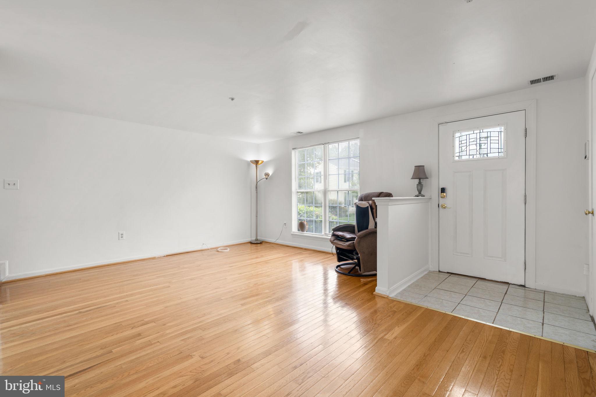 5136 Cranmer Way Capitol Heights, MD 20743 - Photo 7 of 28 a view of a room with wooden floor and a window
