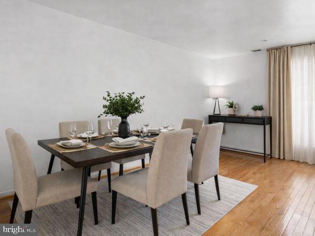5136 Cranmer Way Capitol Heights, MD 20743 - Photo 10 of 28 a view of a dining room with furniture and wooden floor