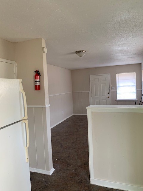 7812 Tierwester Street, Unit 107 Houston, TX 77021 - Photo 12 of 13 a view of hallway with window and refrigerator
