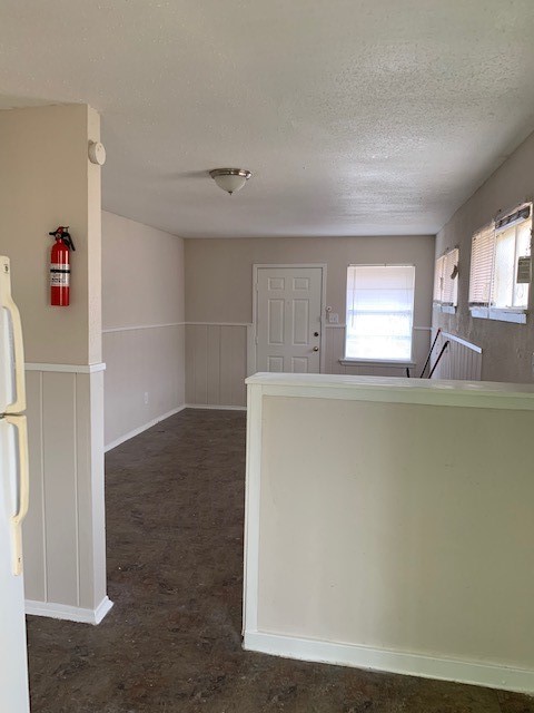 7812 Tierwester Street, Unit 107 Houston, TX 77021 - Photo 13 of 13 a view of a livingroom with wooden furniture and window