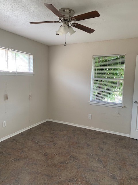 7812 Tierwester Street, Unit 107 Houston, TX 77021 - Photo 5 of 13 an empty room with a window