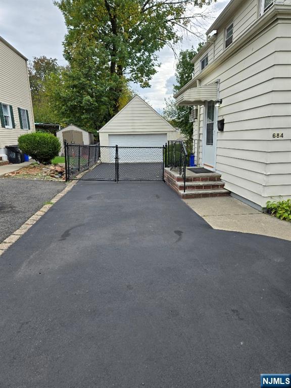 684 Edgewater Avenue, Unit 1 Ridgefield, NJ 07657 - Photo 16 of 20 a view of a white house with a street