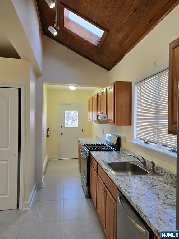 684 Edgewater Avenue, Unit 1 Ridgefield, NJ 07657 - Photo 8 of 20 a kitchen with granite countertop a sink and cabinets