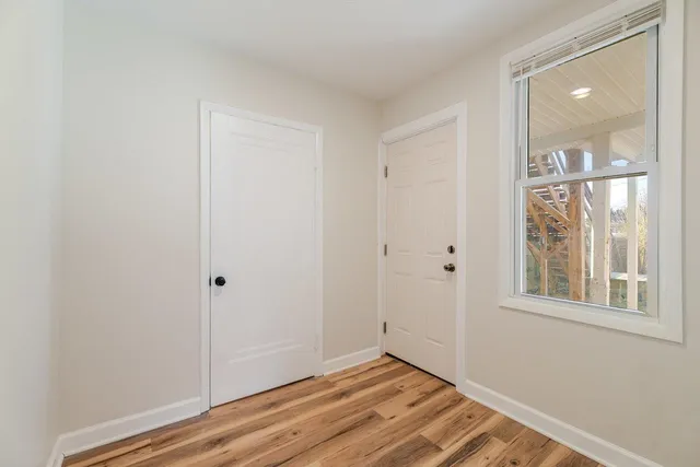 a view of a room that has a window in it