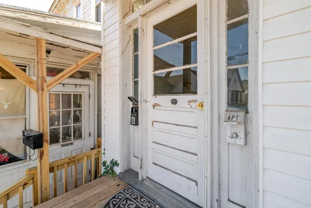 a view of a bedroom with a bed and bathroom