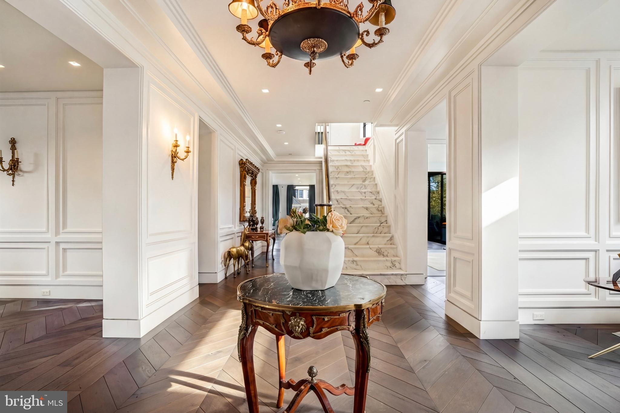 2709 36th Street Northwest Washington, DC 20007 - Photo 3 of 50 a dining room with wooden floor and chandelier