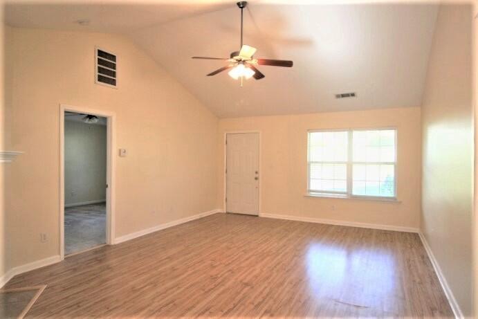 206 Corley Circle Grovetown, GA 30813 - Photo 2 of 13 Great Room - fireplace, vaulted ceiling, ceiling fan and laminate flooring.