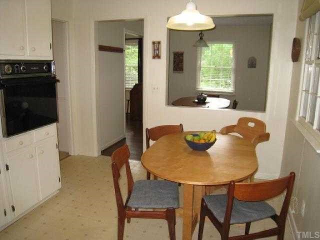 6307 Brandywine Road Raleigh, NC 27607 - Photo 6 of 12 a view of a dining room with furniture and window