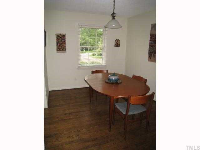 6307 Brandywine Road Raleigh, NC 27607 - Photo 9 of 12 a view of a workspace with furniture and window