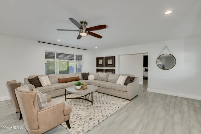 a living room with furniture and a window