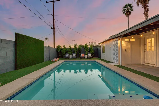 a view of swimming pool with a patio