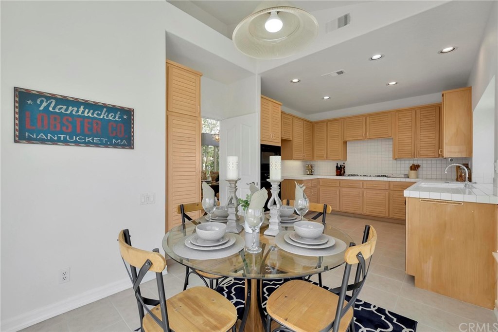 5639 Spinnaker Bay Drive Long Beach, CA 90803 - Photo 11 of 27 a view of a dining room with furniture and wooden floor