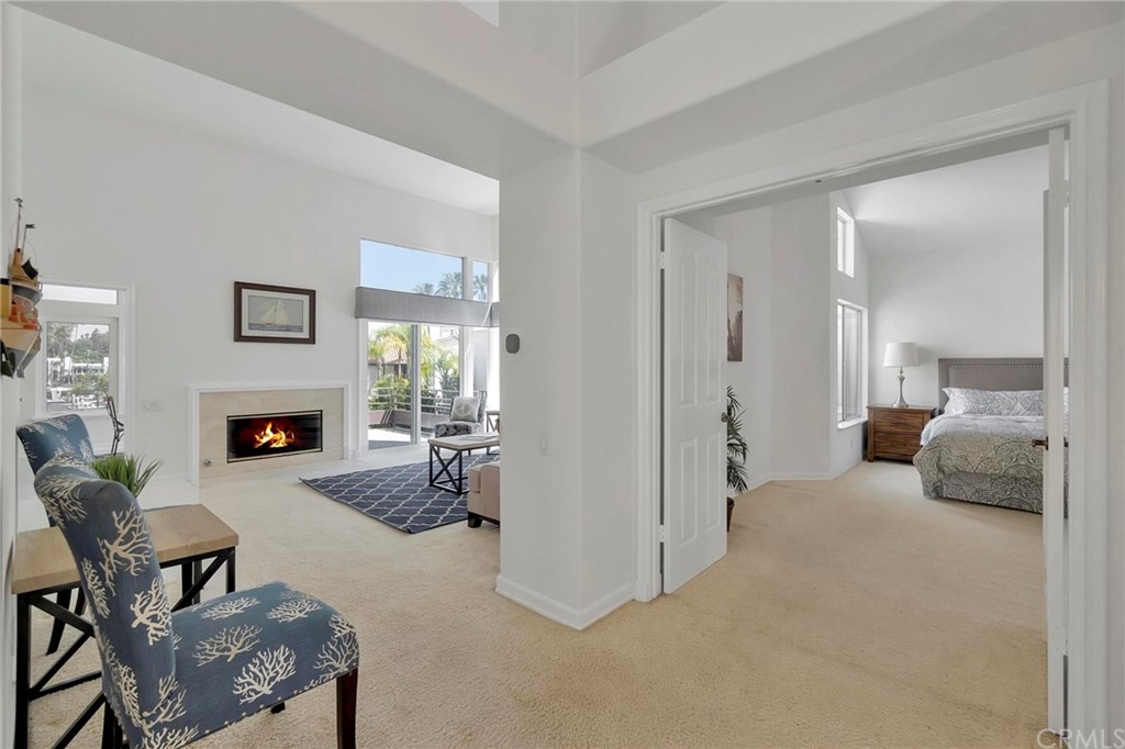 5639 Spinnaker Bay Drive Long Beach, CA 90803 - Photo 13 of 27 a bedroom with furniture and a fireplace