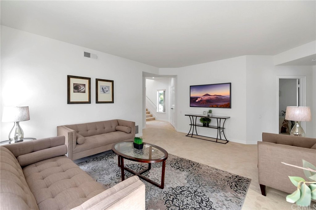 5639 Spinnaker Bay Drive Long Beach, CA 90803 - Photo 17 of 27 a living room with furniture and a flat screen tv