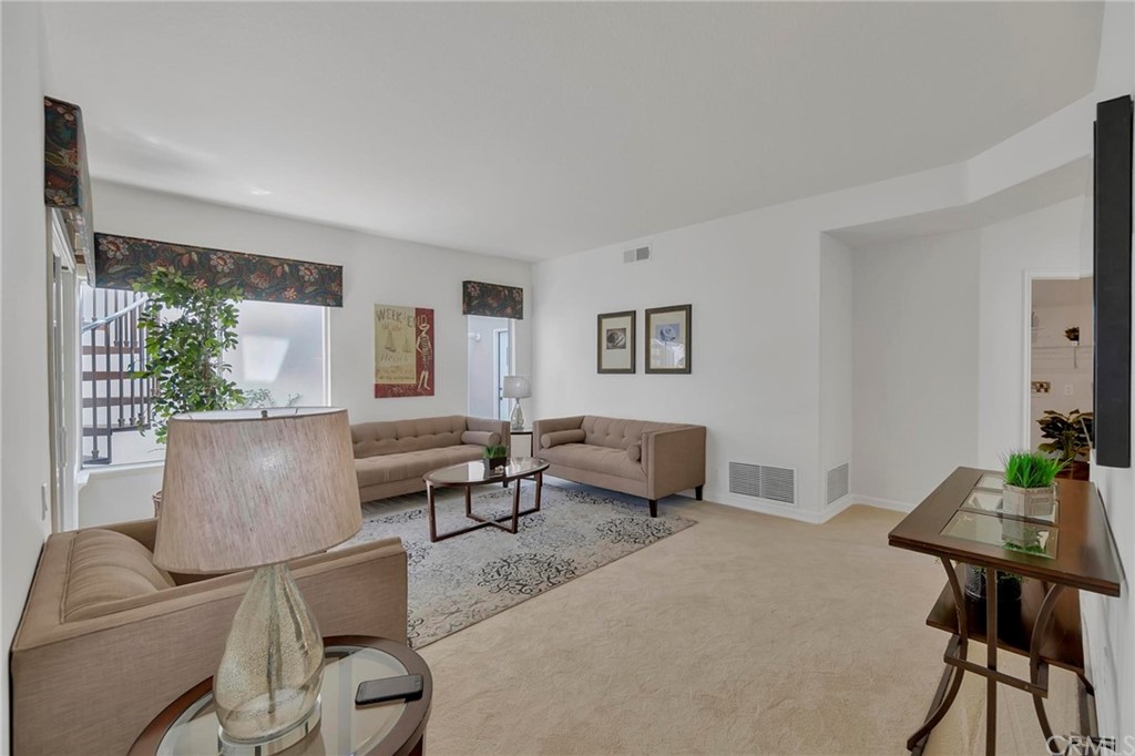 5639 Spinnaker Bay Drive Long Beach, CA 90803 - Photo 18 of 27 a living room with furniture and a table