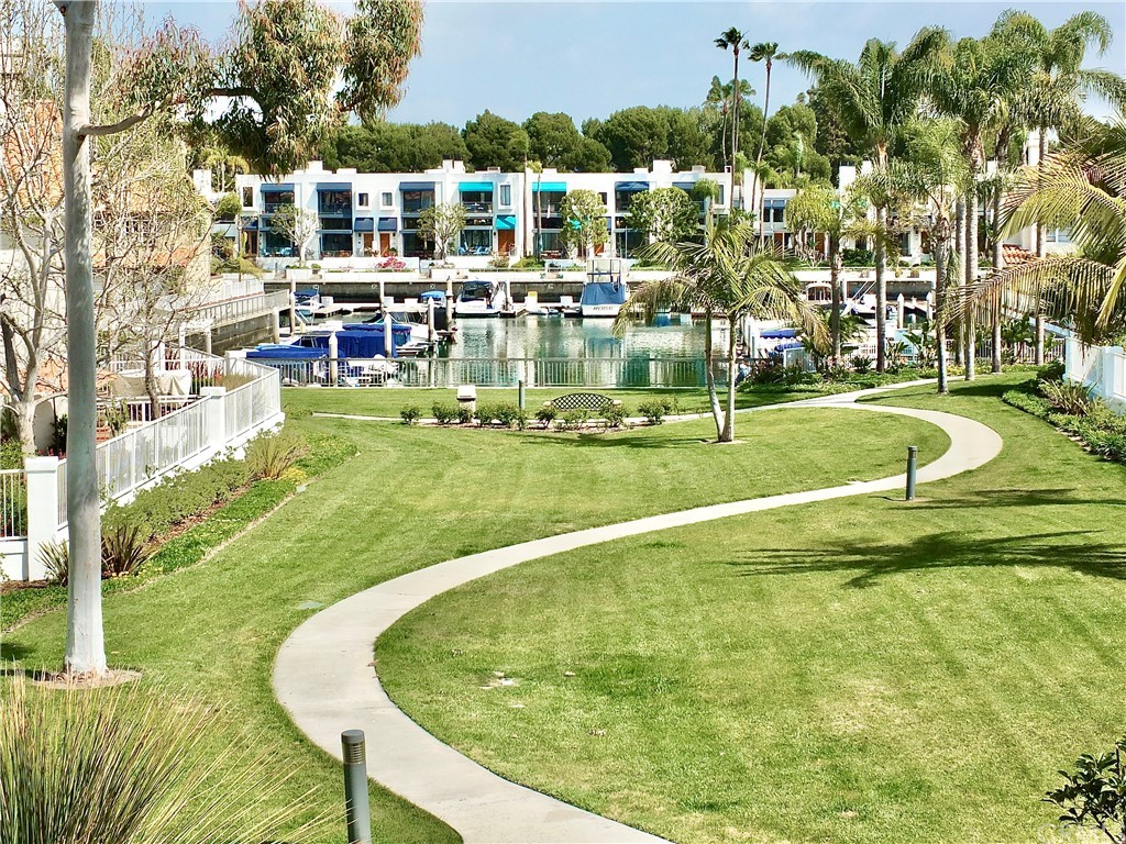 5639 Spinnaker Bay Drive Long Beach, CA 90803 - Photo 2 of 27 a swimming pool with outdoor seating and yard