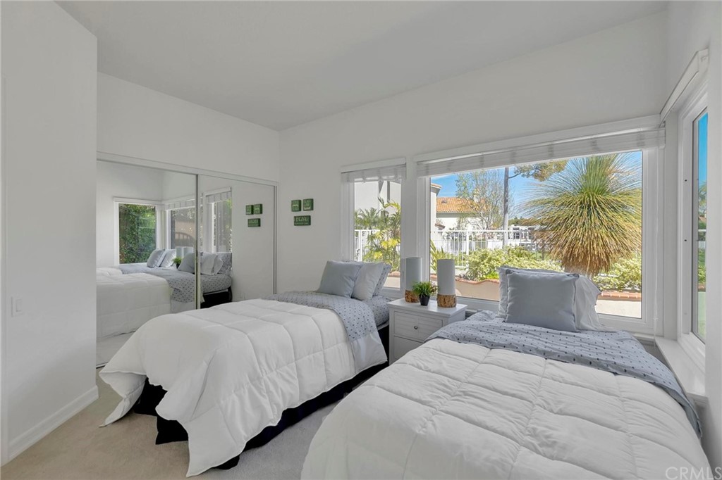 5639 Spinnaker Bay Drive Long Beach, CA 90803 - Photo 21 of 27 a bedroom with two beds and large window