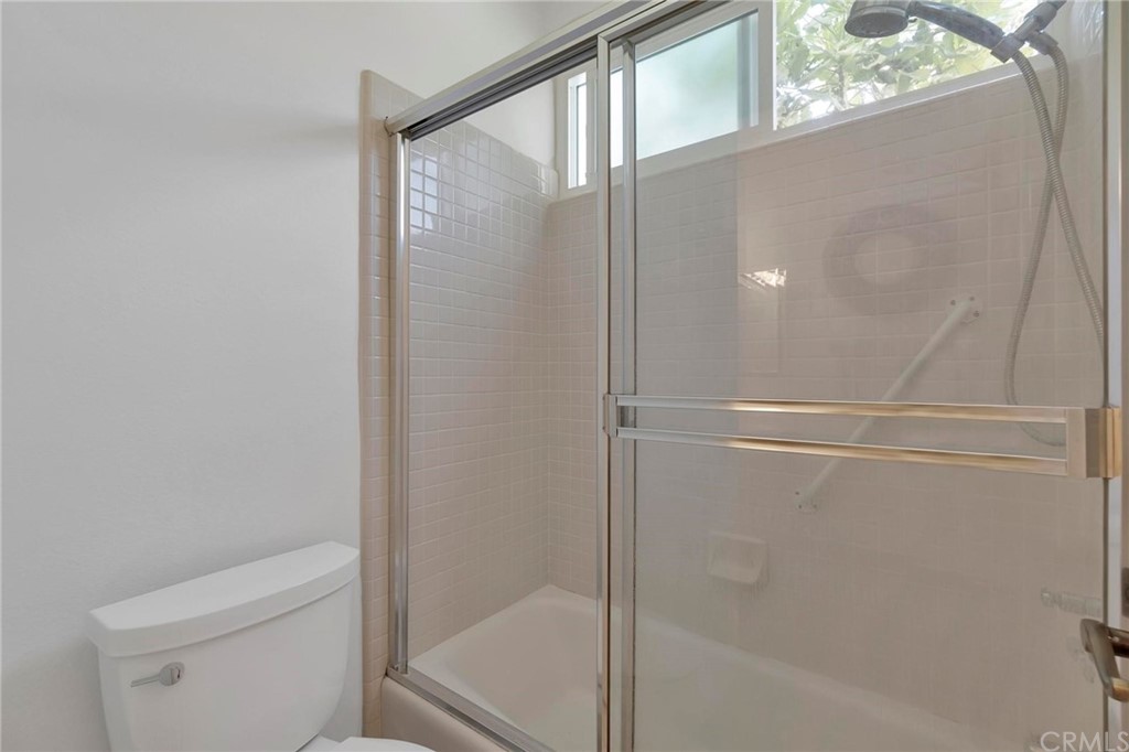 5639 Spinnaker Bay Drive Long Beach, CA 90803 - Photo 23 of 27 a bathroom with a glass shower door