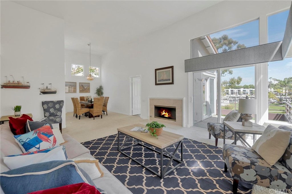 5639 Spinnaker Bay Drive Long Beach, CA 90803 - Photo 6 of 27 a living room with furniture and a fireplace
